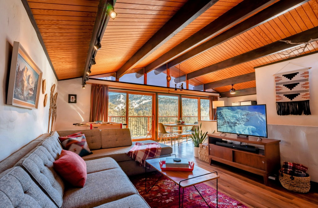 Welcome to your home away from home, where Midcentury modern meets vintage European chalet.