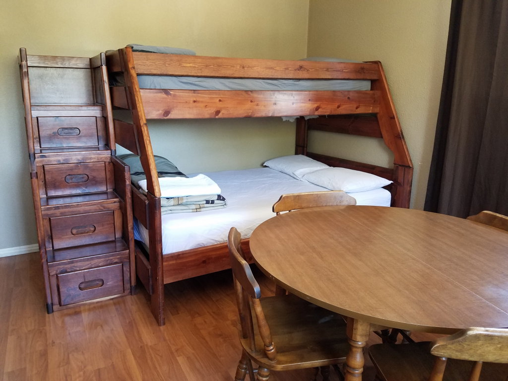 Bunk bed with stairs, sleeps 2-3, table and chairs