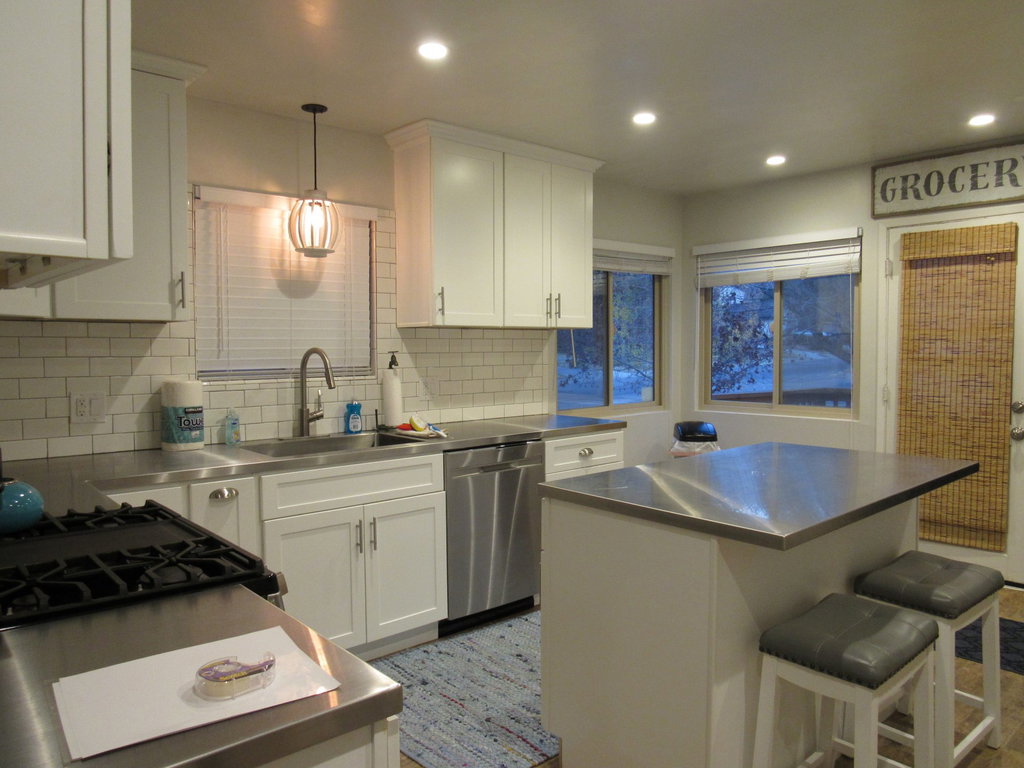 Kitchen offers door access to a small side deck off the front yard
